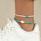 Aqua anklet duo pair featuring beads and conch shell