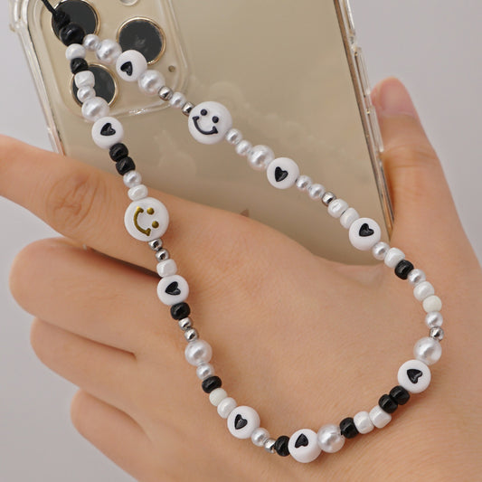 Sisterhood Store black and white smiley face phone charm is so preppy and cute! Perfect for your phone or bag!