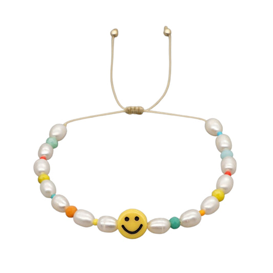 smiley face and pearl bracelet